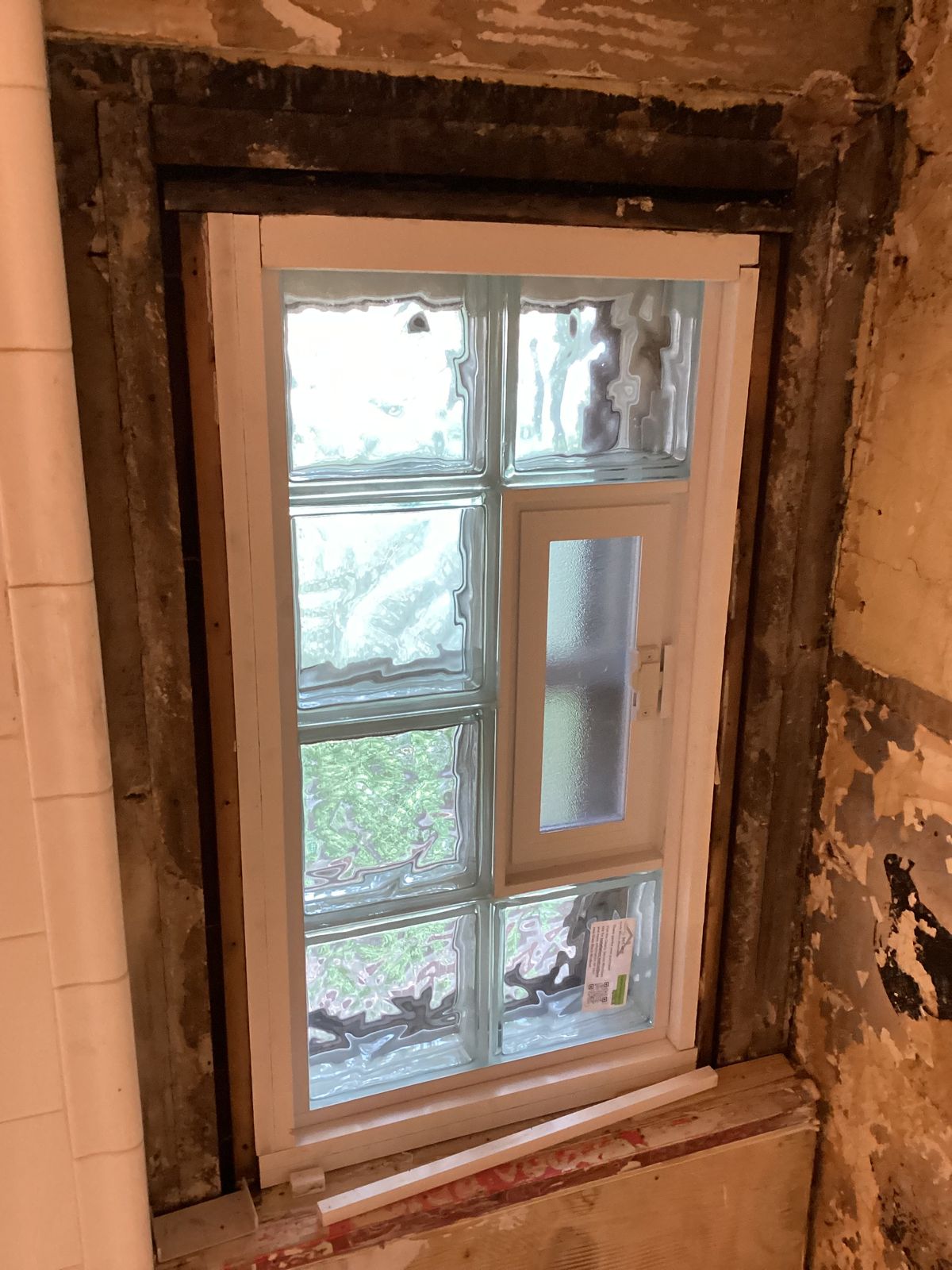 New glass block window installed before the surrounding wall was finished