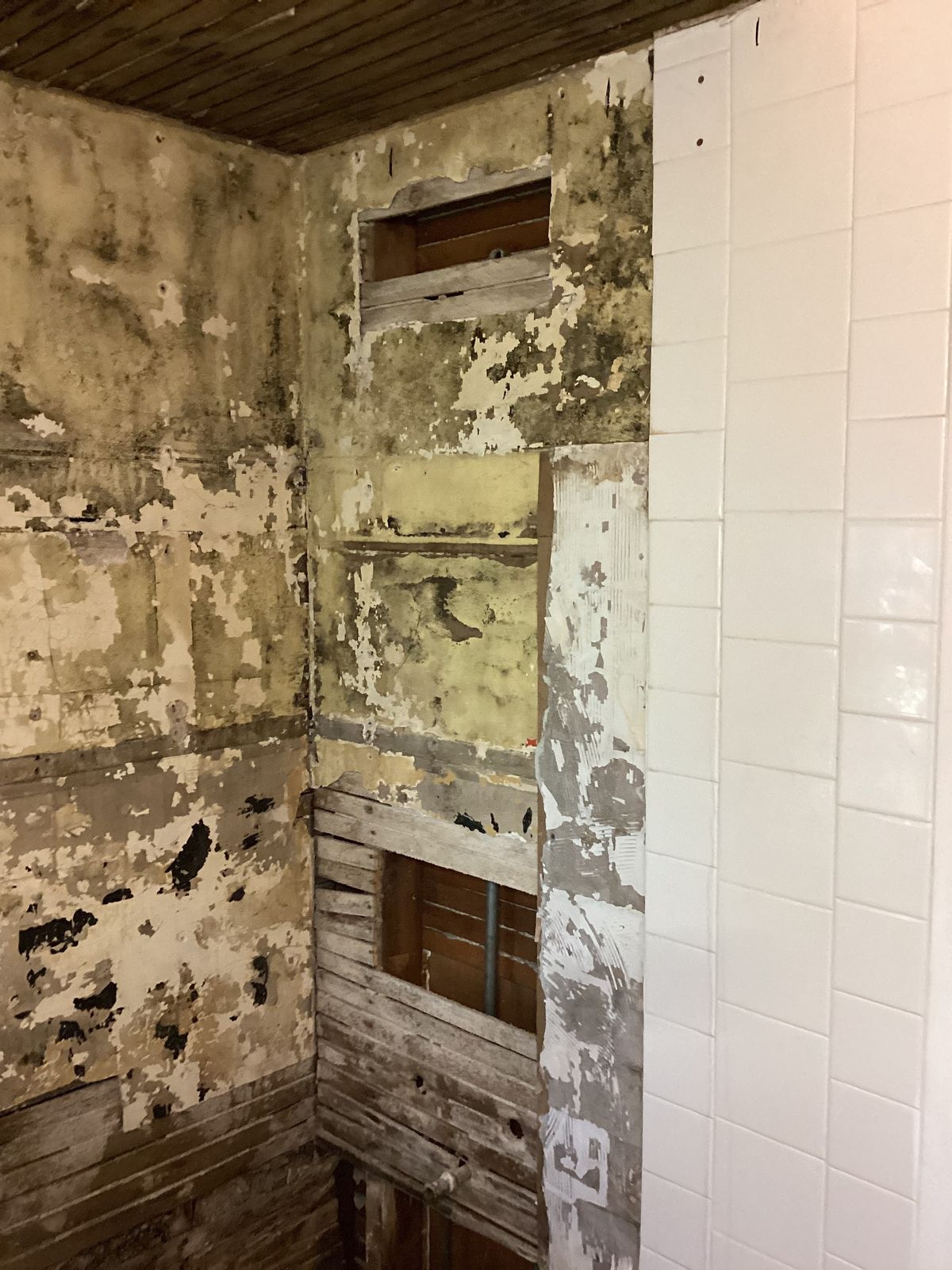 Deteriorated wall surface exposed during demolition