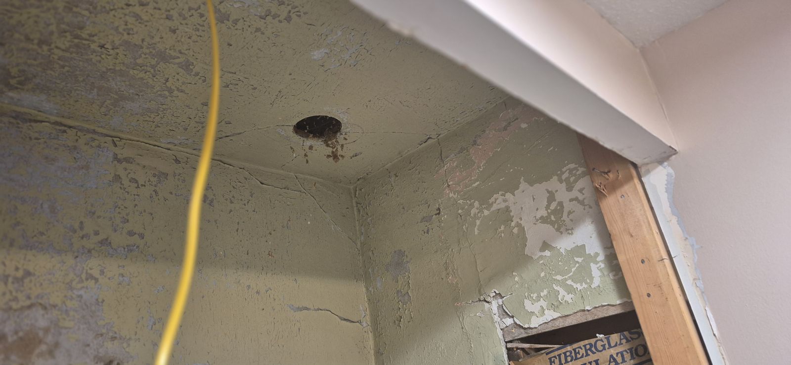 Water-damaged wall and ceiling found during demolition